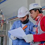 Two Engineers Looking over Specs- Addressing The Skills Gap In The Energy Sector | Resources Hub Page | Energy Sector Recruitment | Pangea Talent Solutions